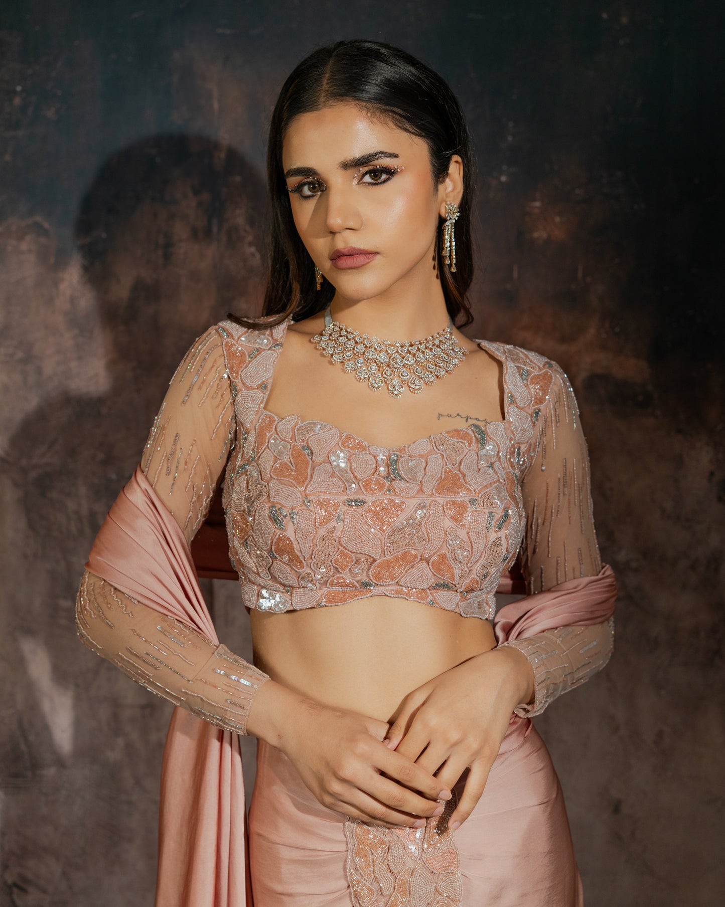 Rosè pre-draped saree with embellished blouse and skirt