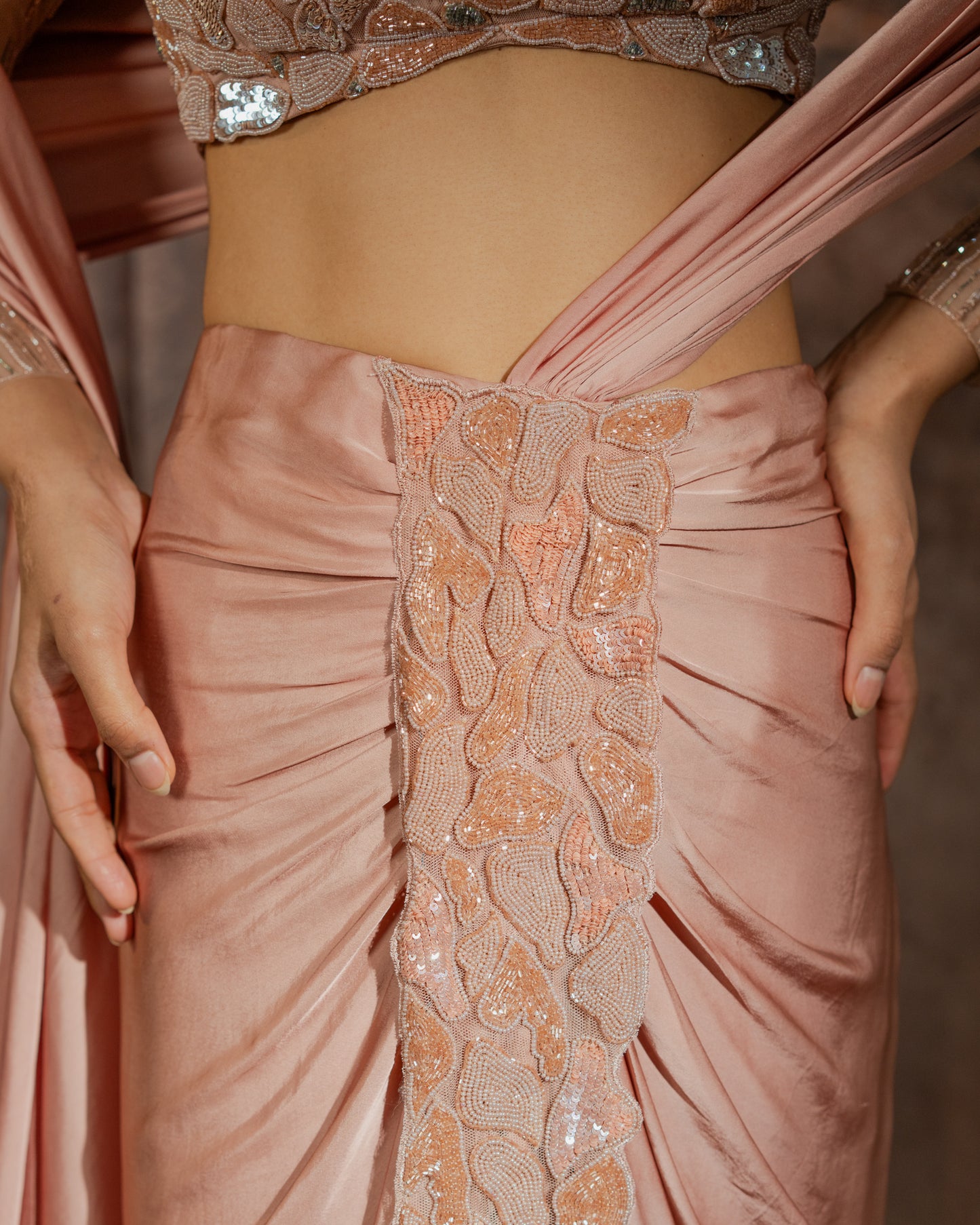 Rosè pre-draped saree with embellished blouse and skirt