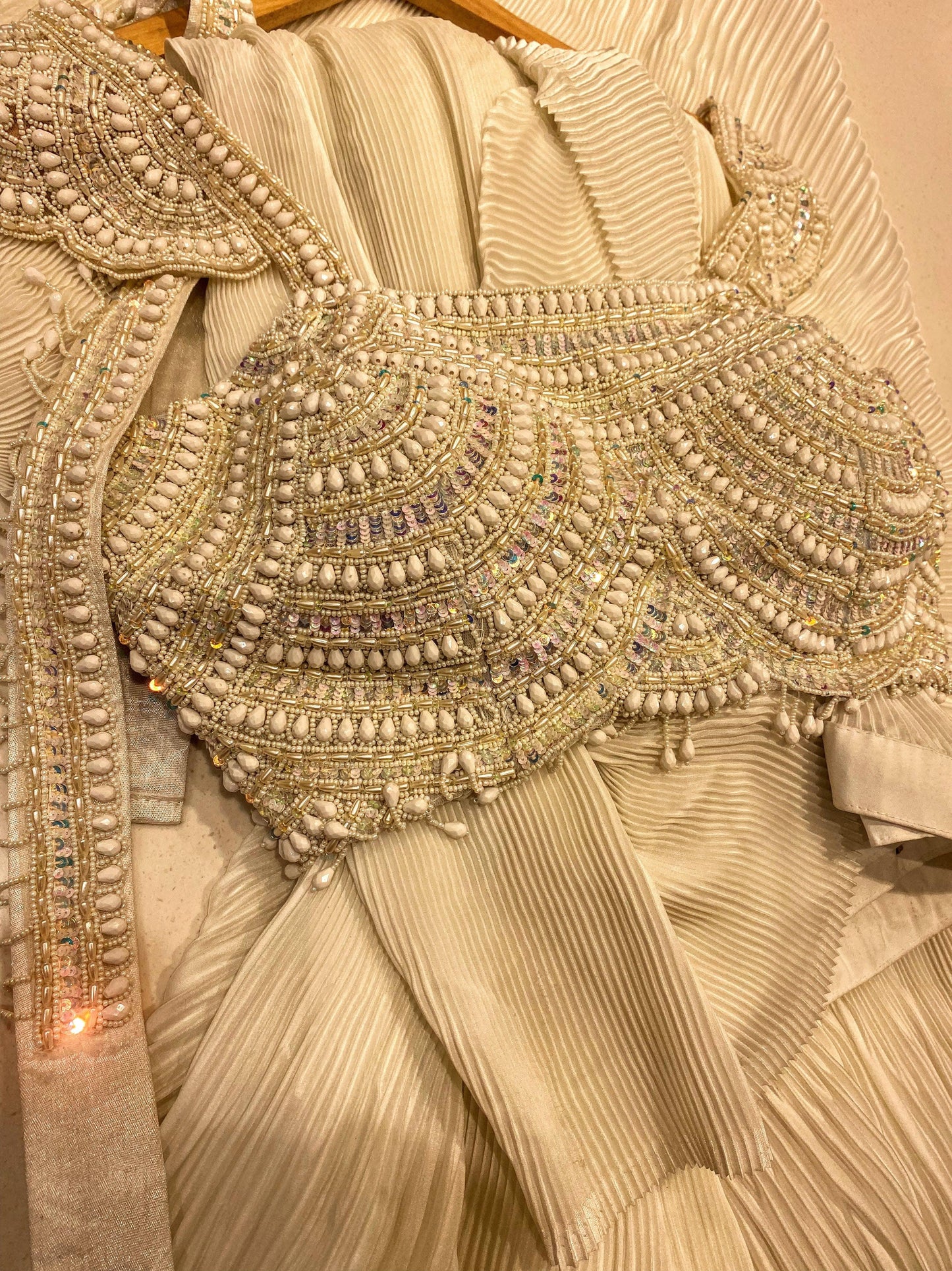 Ivory pre-draped saree with a scalloped embellished blouse - Nishi Madaan Label