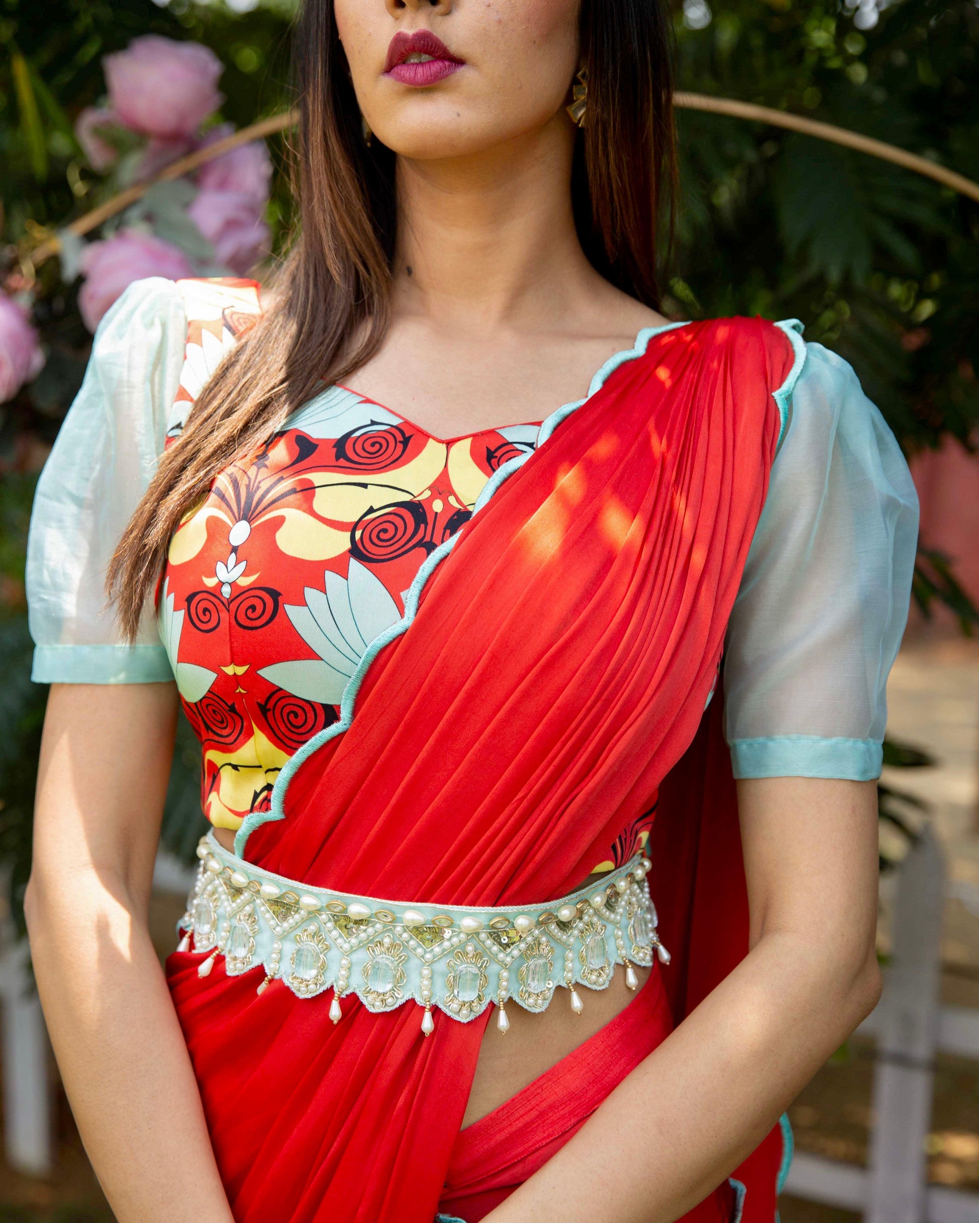 Red pre-draped saree with a printed blouse and embellished belt - Nishi Madaan Label