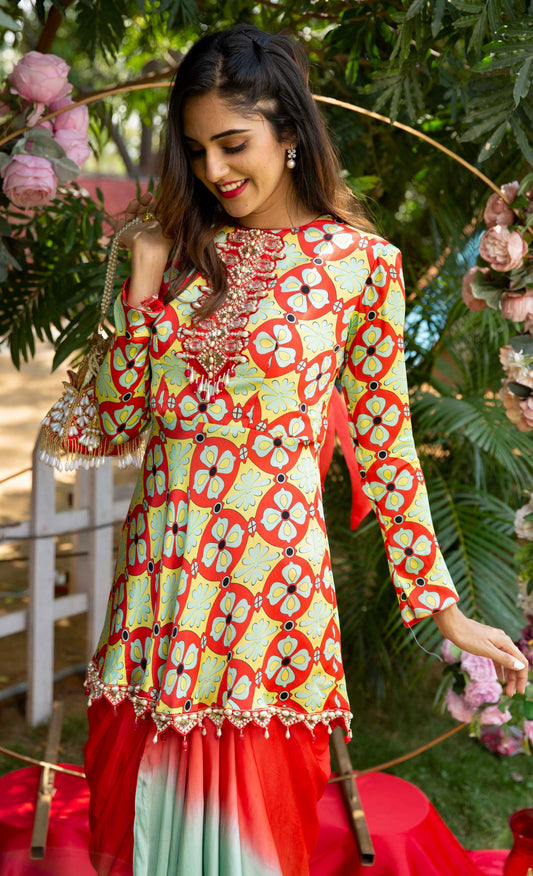 The 'Splash of flora' embellished peplum top and ombrè draped skirt. - Nishi Madaan Label