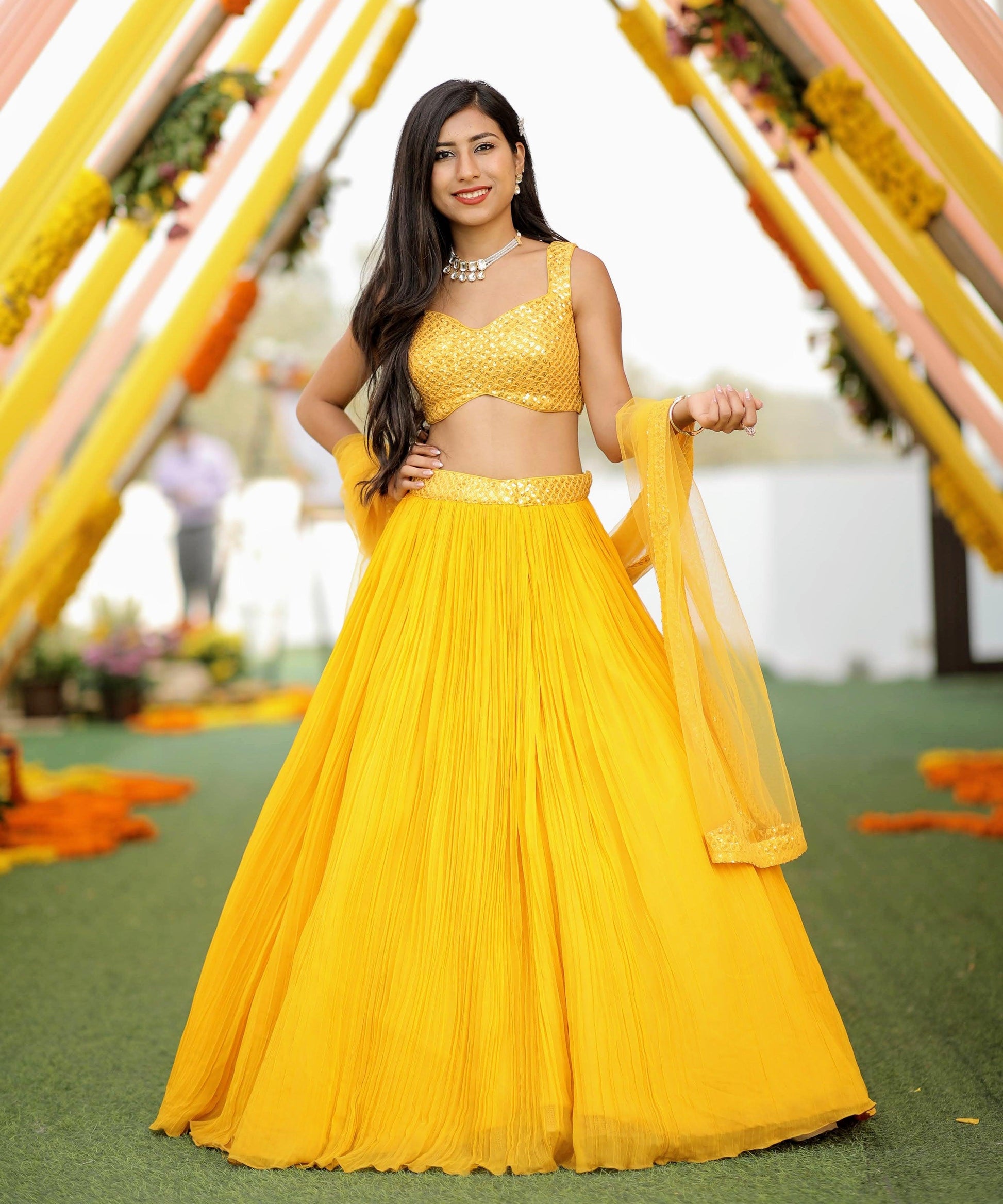 A yellow lehenga set - Nishi Madaan Label