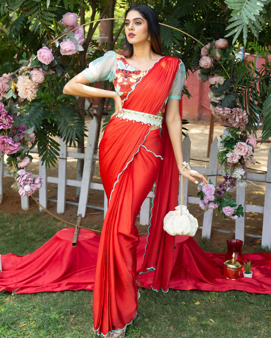 Red pre-draped saree with a printed blouse and embellished belt - Nishi Madaan Label