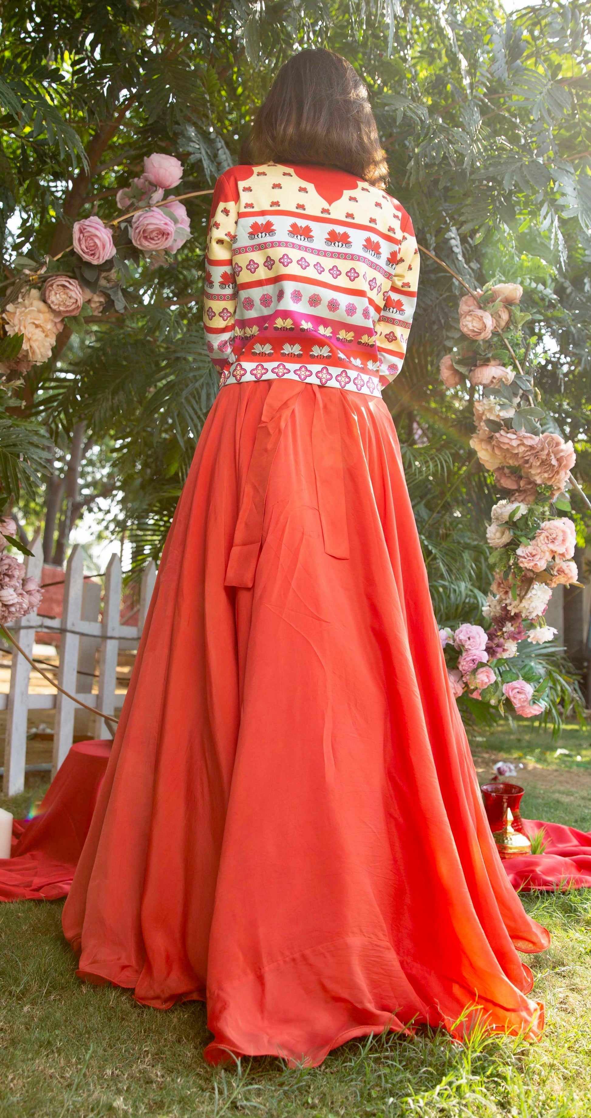 The 'summer breeze' red lehenga set with a printed jacket - Nishi Madaan Label
